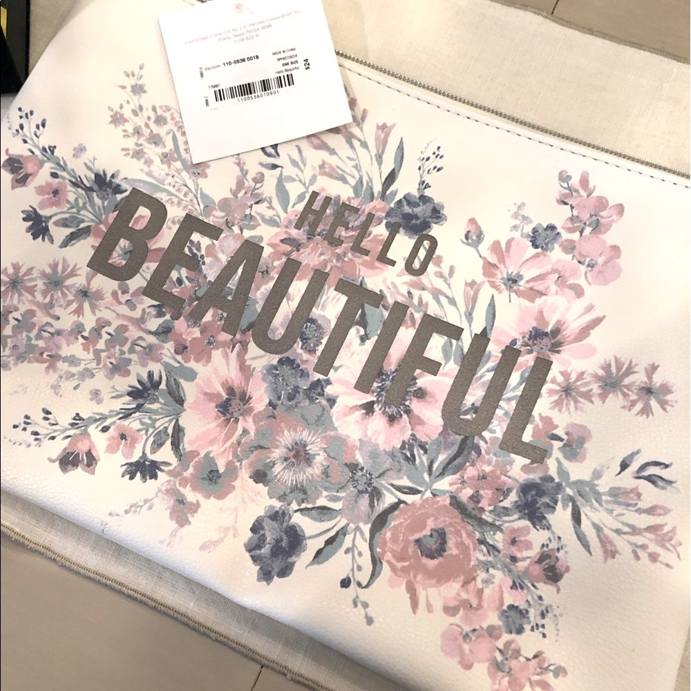 Large cosmetic/travel pouch. Floral design NWT
